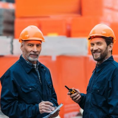 two-builders-in-helmets-working-with-walkie-talkie-2021-08-31-22-09-20-utc-1.jpg